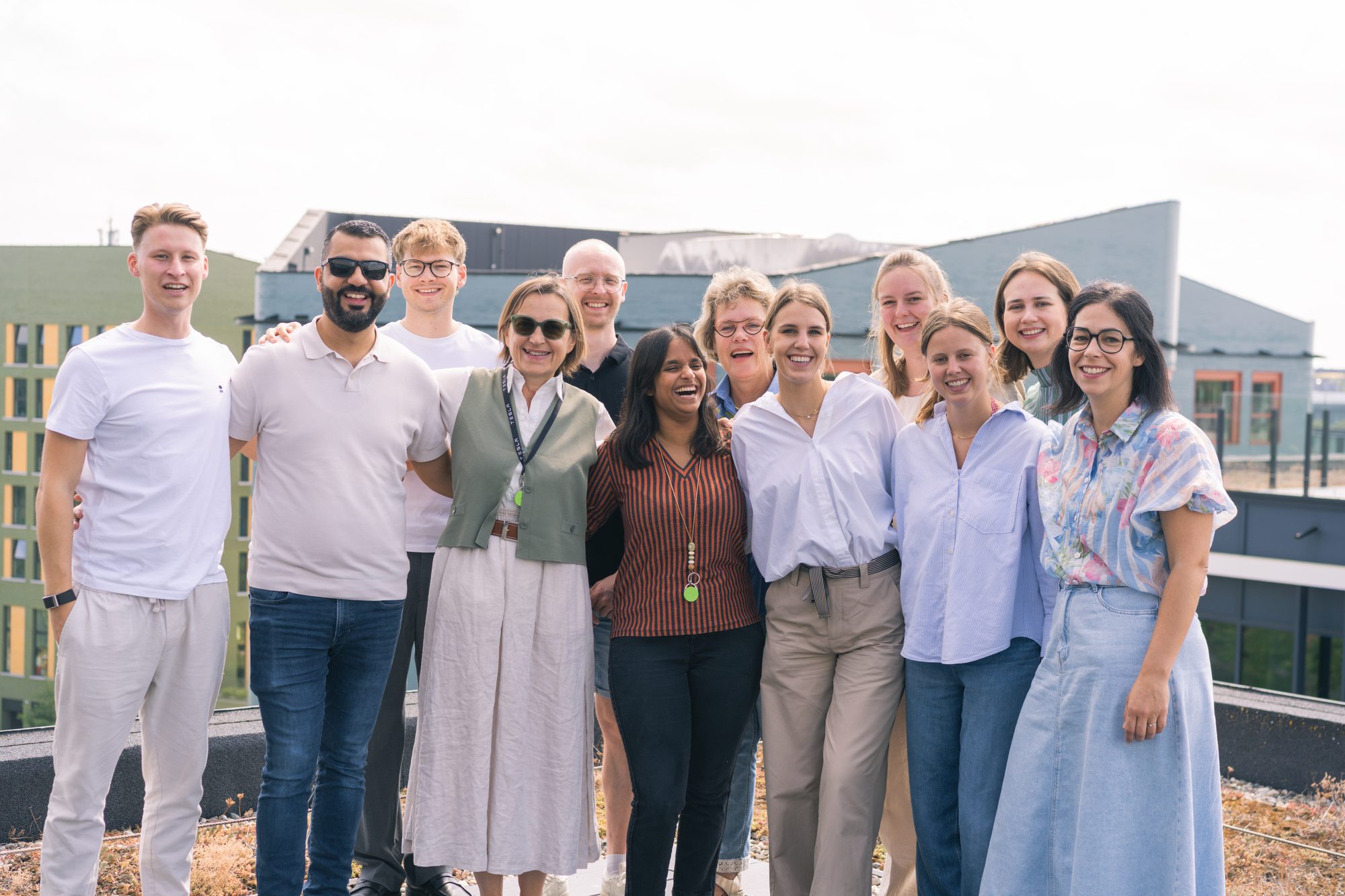 The M.P.C.A. International team on the office terrace in Ghent